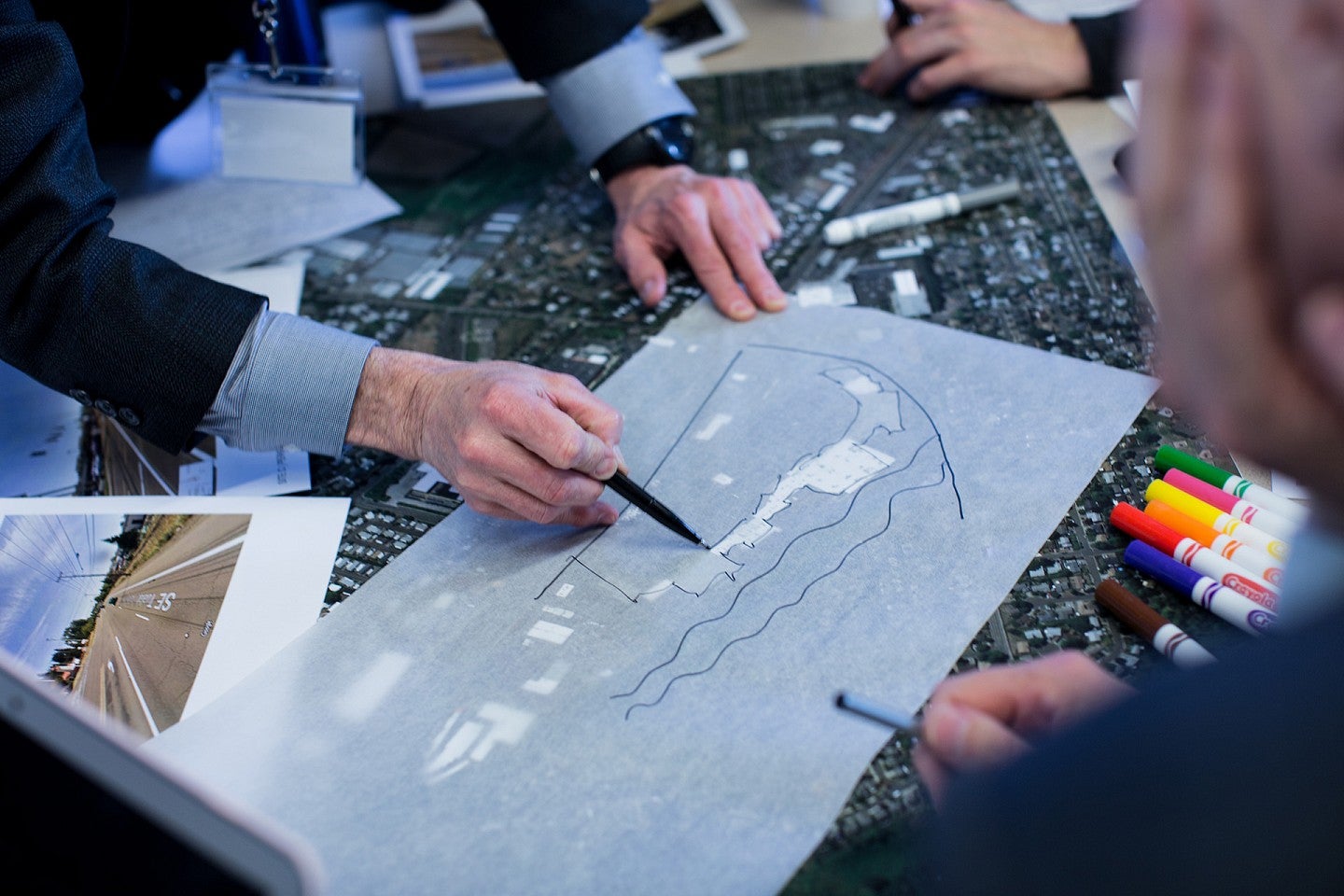 Students work on charrettes over a city map