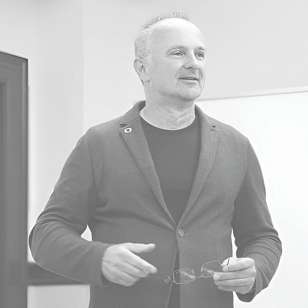 Black and white headshot of Attila Schillinger